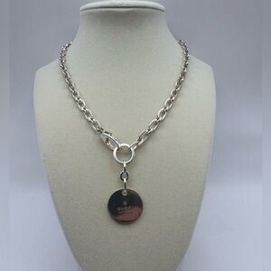 Gucci trademark logo silver round tag charm necklace.